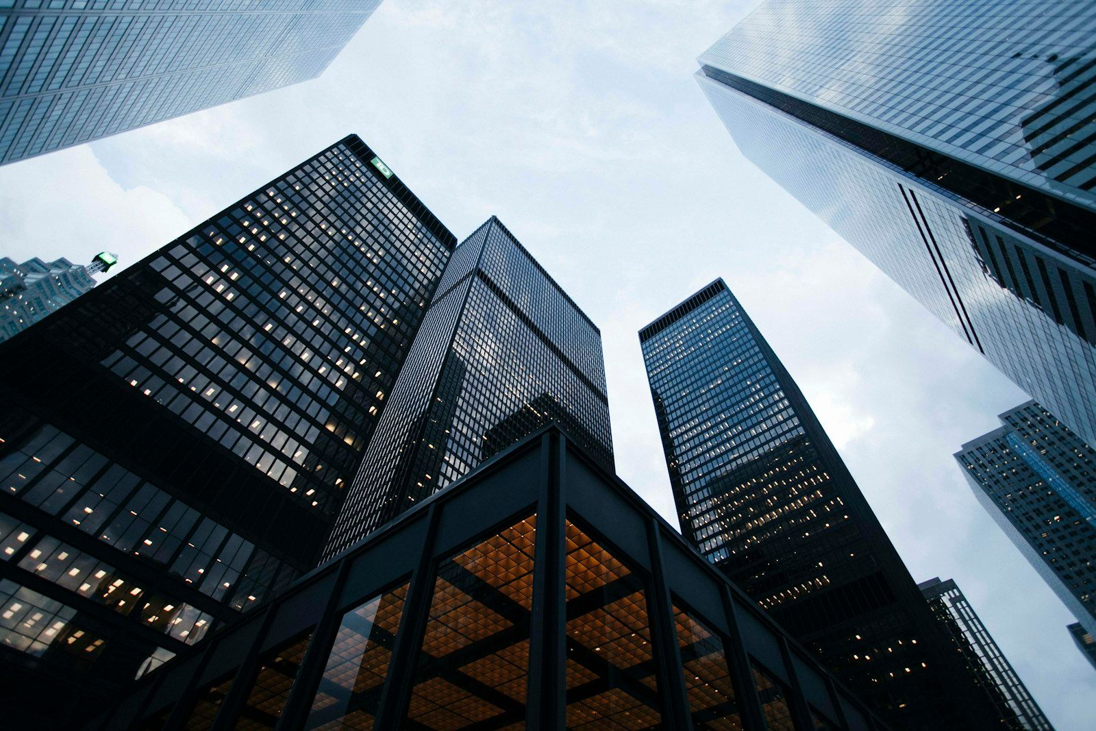 Modern corporate glass skyscraper reaching into the sky, symbolizing business transformation
