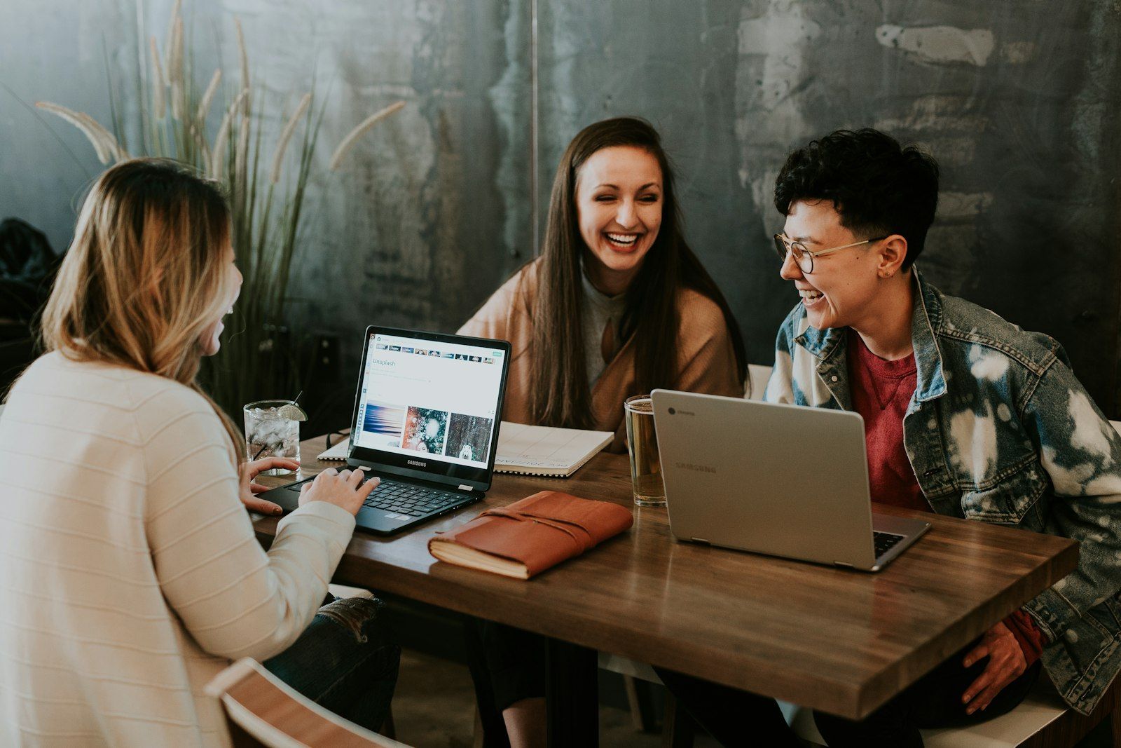 Modern creative team collaborating around a bright desk, symbolizing the future of work